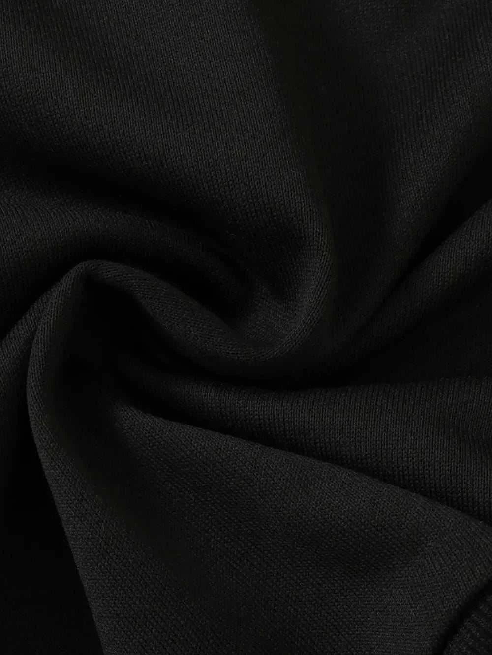 Close-up of black fabric texture for children's dinosaur sweatshirt set made of polyester and elastane blend