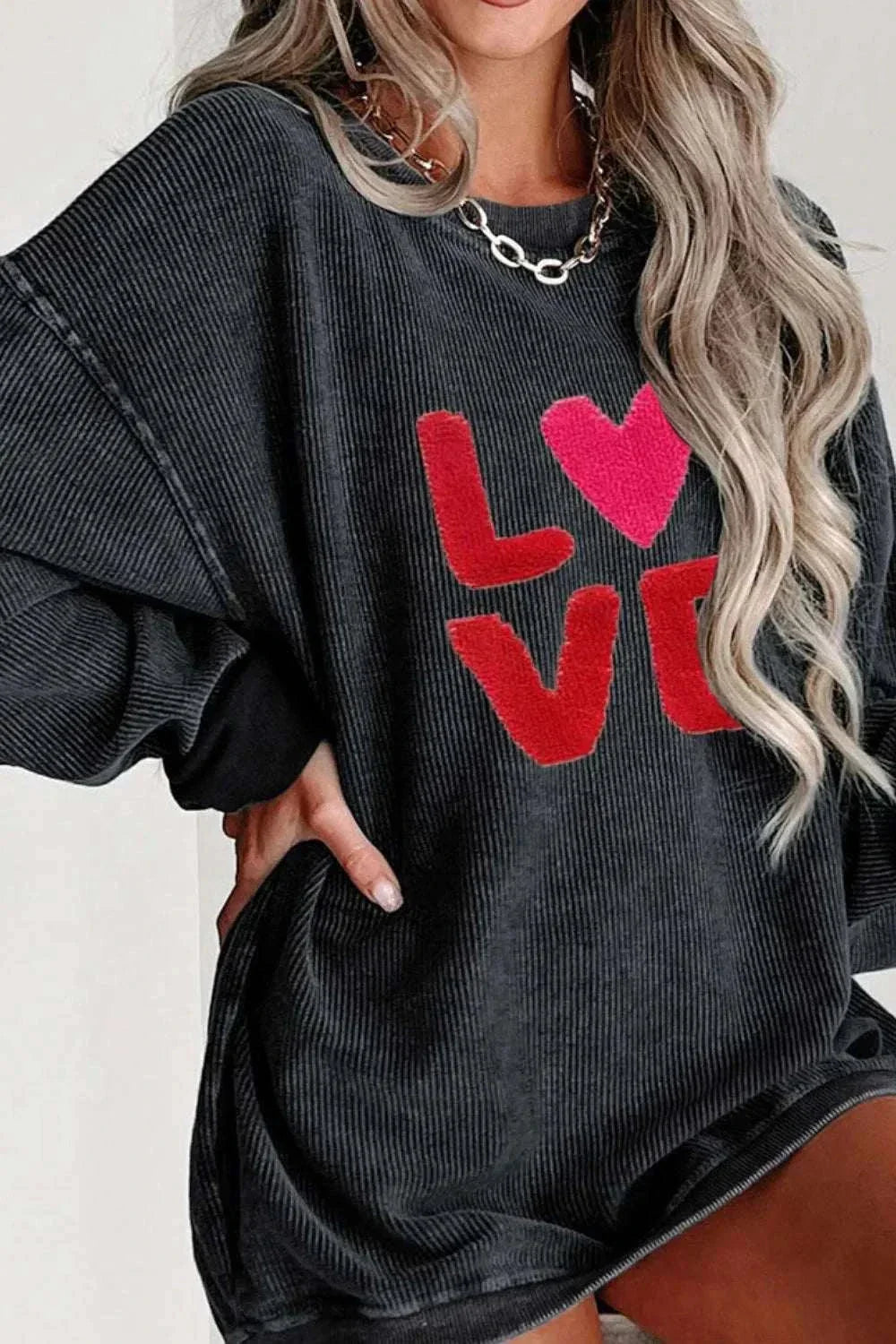 Black Valentine’s Day LOVE round neck long sleeve sweatshirt with red and pink letters and slightly stretchy polyester fabric