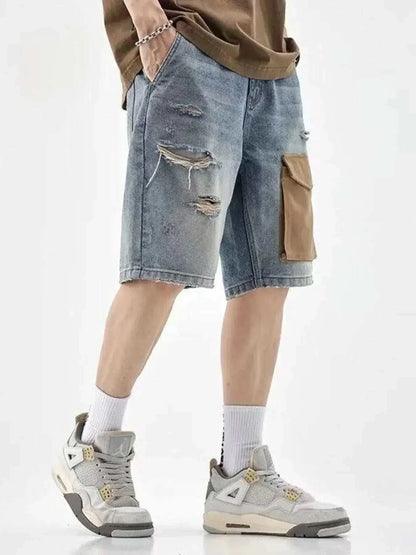 Men's distressed denim shorts with brown utility pocket and ripped details, styled with sneakers and casual top