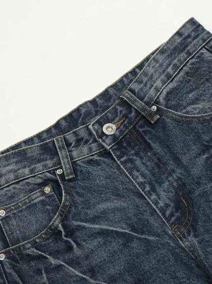 Close-up of dark washed men's wide leg jeans with cat's whisker details and slight stretch fabric