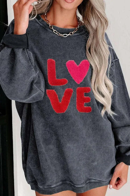 Valentine’s Day LOVE long sleeve sweatshirt with red letters and heart design on charcoal gray fabric