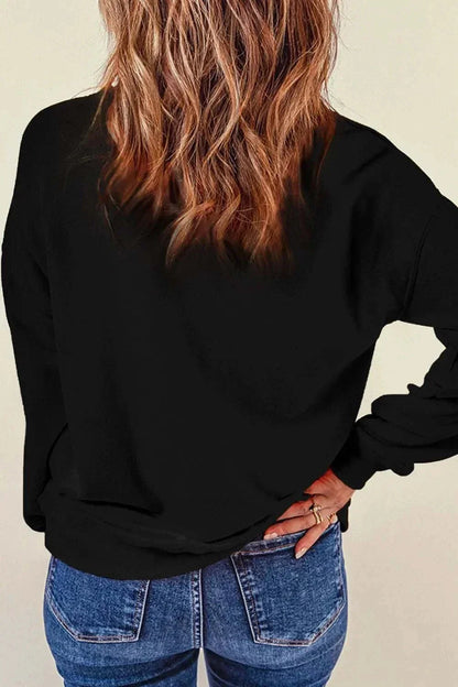 Back view of woman wearing black Rhinestone LOVE round neck long sleeve sweatshirt with slightly stretchy fabric and basic style