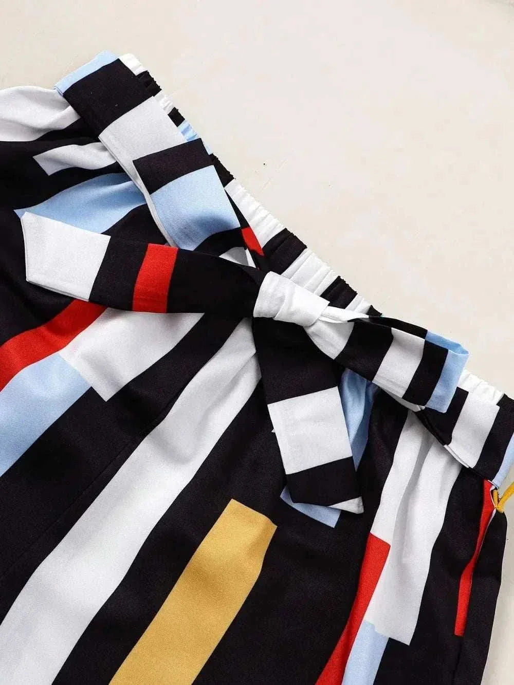 Children's ruffled striped pants with a bow detail from a spaghetti strap top and pants set