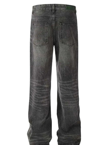 Back view of men's wide leg jeans in washed black with cat's whisker detailing, made of 95% cotton and 5% polyester with slight stretch.