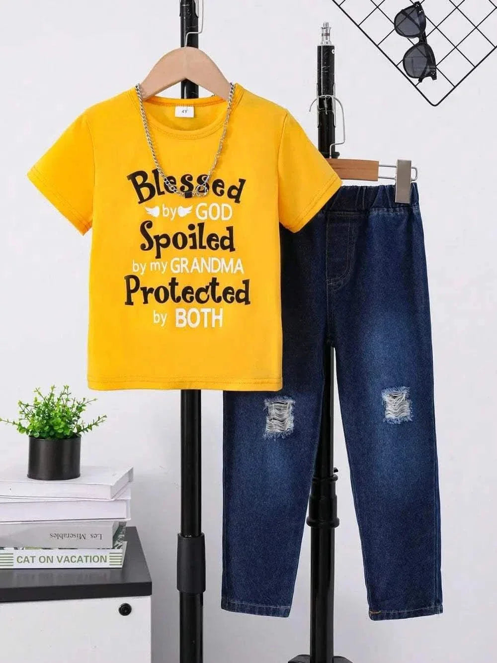 Children's yellow round neck letter graphic t-shirt paired with distressed blue jeans set